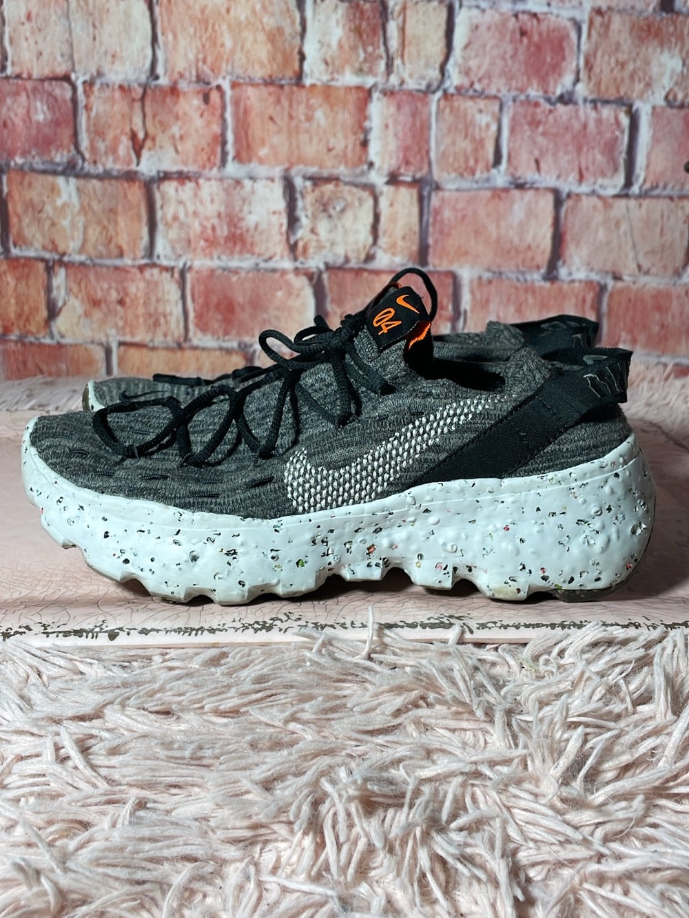 Nike Kids Gray Knit Sneaker with White Speckled Sole and Orange Accent